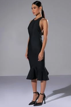 HEIRESS SLEEVELESS PEPLUM DRESS IN BLACK